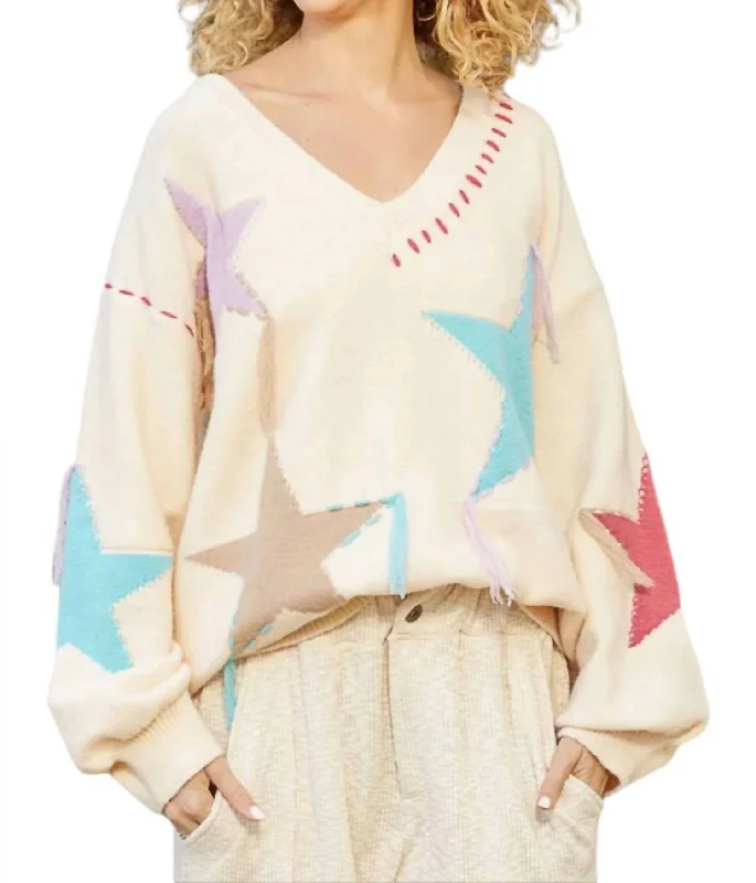 Leisure Travel Star Sweater With Fringe Detail In Beige